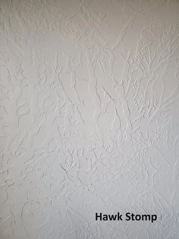 Textured wall surface with 'Hawk Stomp' label.