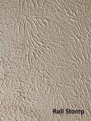 Close-up of textured surface with intricate, raised patterns labeled 'Roll Stomp'.