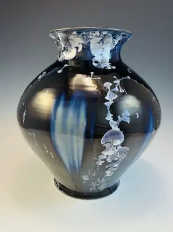 Crystalline glazed white stoneware with Eric's custom black and silver recipe. Blue blushing areas are created by the addition of a couple 'normal' cone 9 glazes. These areas also actively resist crystal growth allowing some control of crystal location