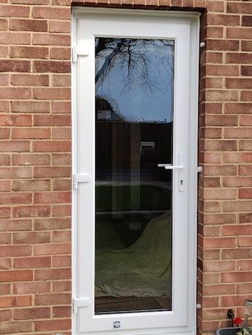 a white uPVC double glaxed door with uPVC handle 
