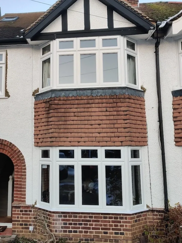A house with two six part uPVC double glazed bay windows