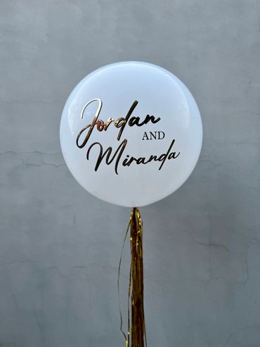 Custom helium balloon with Tassel tail.