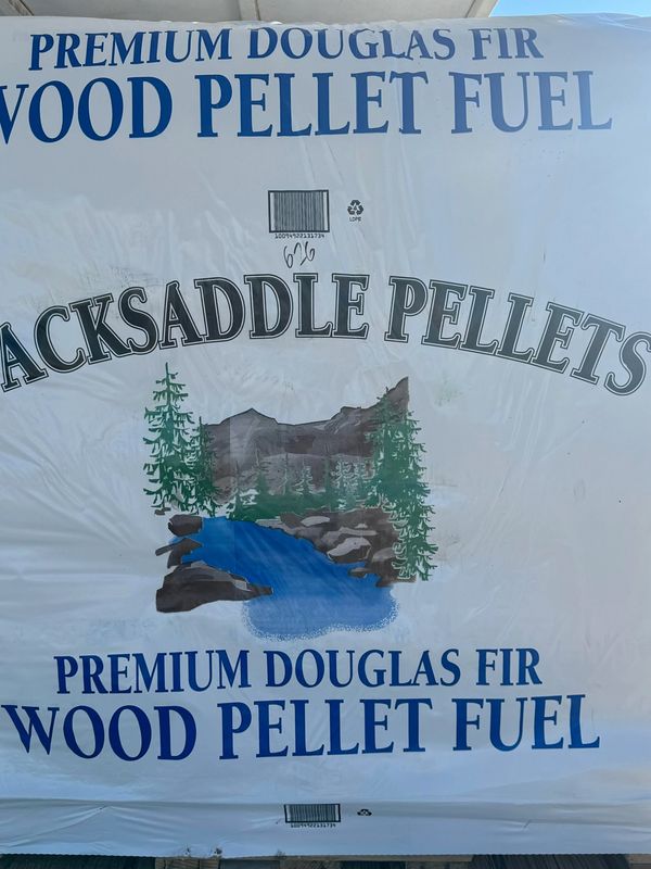 Bag of Premium Douglas Fir wood pellet fuel with nature design.