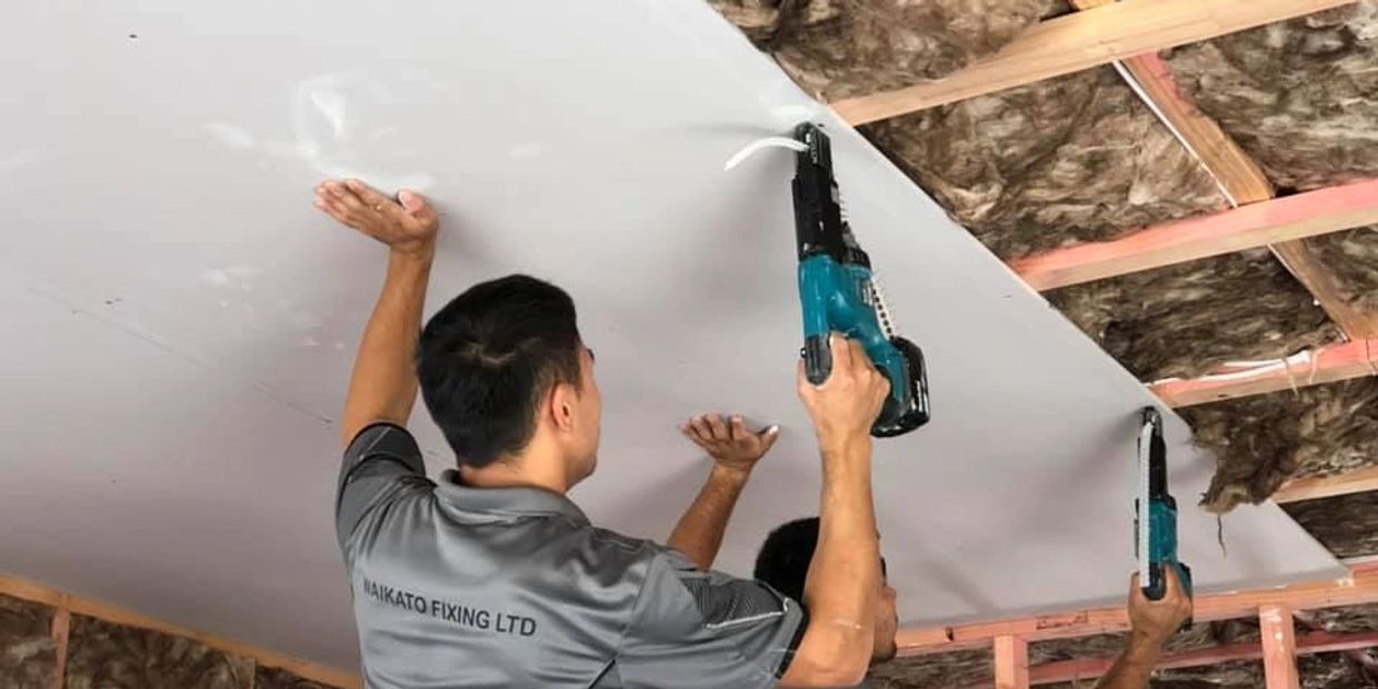 Interior gib fixing in Hamilton. professional gib fixers wearing Waikato fixing's uniform gib fixing