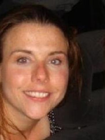 Smiling woman’s face looking straight into the distance