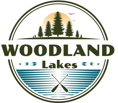 Logo featuring trees, water, and paddles with the text Woodland Lakes.