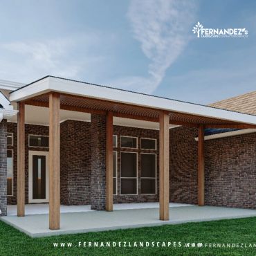 Covered patio with cedar posts behind a brick home