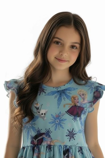 Smiling girl in a blue Frozen-themed dress with snowflakes and characters.