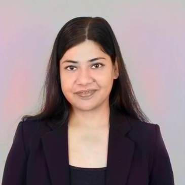 Professional woman smiling in a black blazer against a neutral background.
