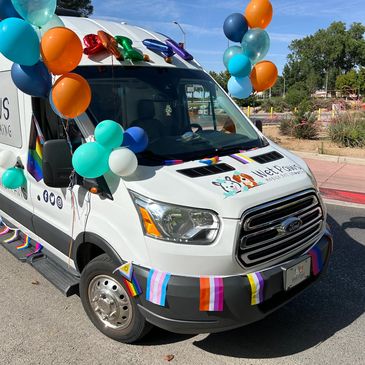 Photo of Wet Paws Mobile Pet Grooming van decorate for the Albuquerque Pride Parade June, 2024