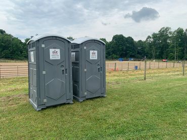 Portable toilets at a rodeo.
