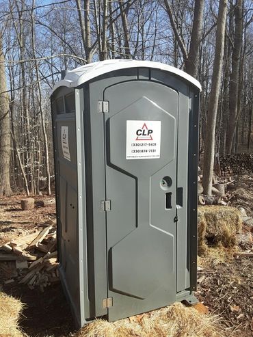 Gray Echo one portable toilet in the woods near Deersville, Ohio.