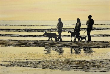 Three women  and their dogs walking on the sand at low tide.