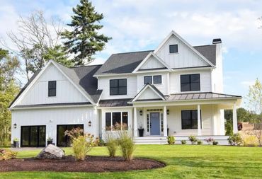 Two story home with combination of Hardie lap siding and Hardie Board & Batten siding painted white