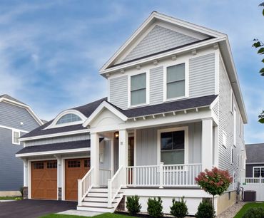 Home with combination of light gray Hardie Board & Batten, Hardie lap siding and Hardie shake siding