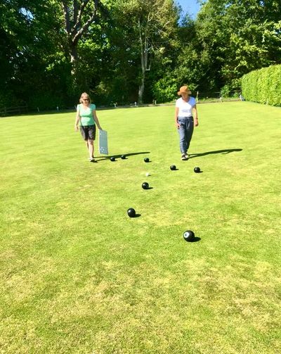Two ladies practicing bowls at Sutton Bowls Club 