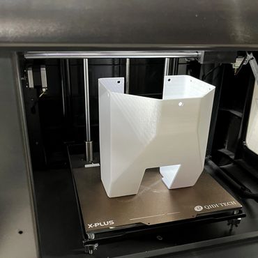 3D printed housing in the 3D printer at the end of the printing process.
