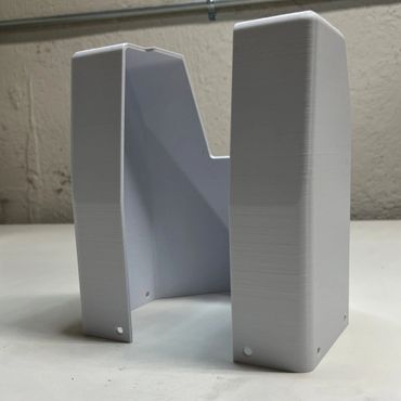 A 3D printed housing for an inspection gage.