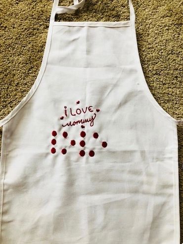White child apron. I love mommy in print, love in Braille