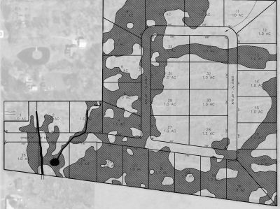 Black and white land plot map with shaded areas and lot measurements.