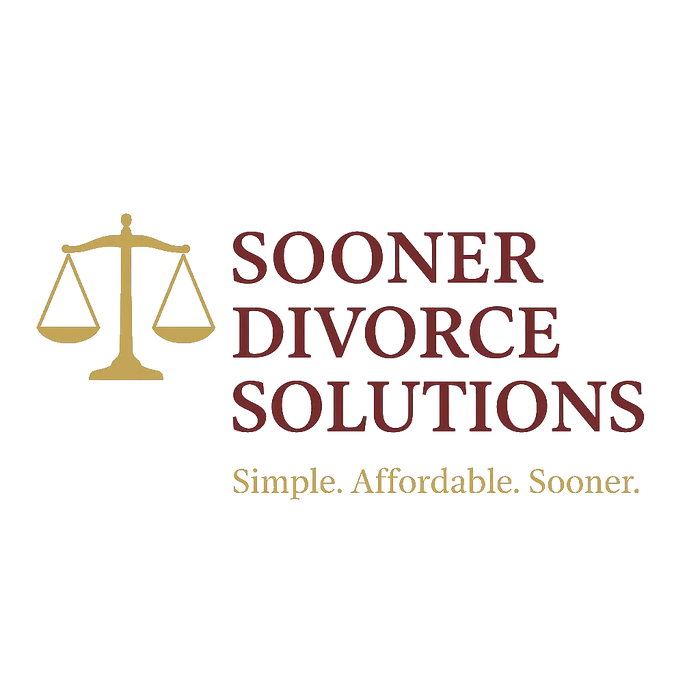 A sleek black sports car parked on a driveway with a modern house in the background.