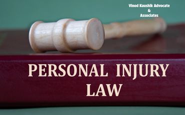 Wooden gavel on a book titled 'Personal Injury Law' with firm name in the corner.