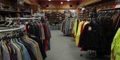 Interior photo showing primarily rain gear and Carhartt shirts