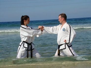 Lightning ITK Taekwondo mentors Mr. and Mrs. Howes techniques