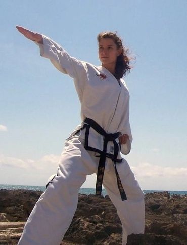 Lightning ITF Taekwondo mentor Mrs. Sonya Howes knife hand strike.