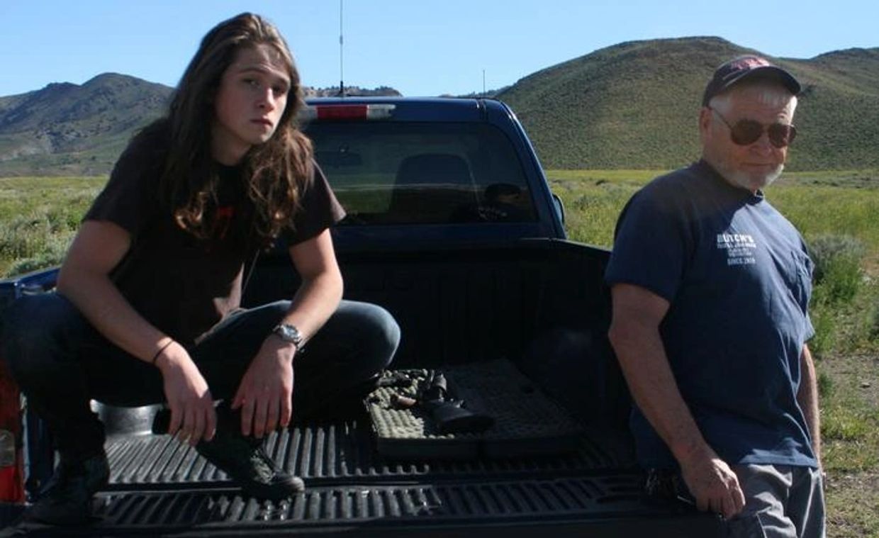 Pictured: The author and his son in the back of a pick up truck in the hills of Norther Nevada.