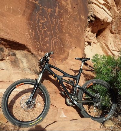 A drawing on the wall and a mountain bike