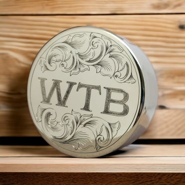 Bluegrass Engraving brass dip can and lid set, engraved with initials and scrollwork.