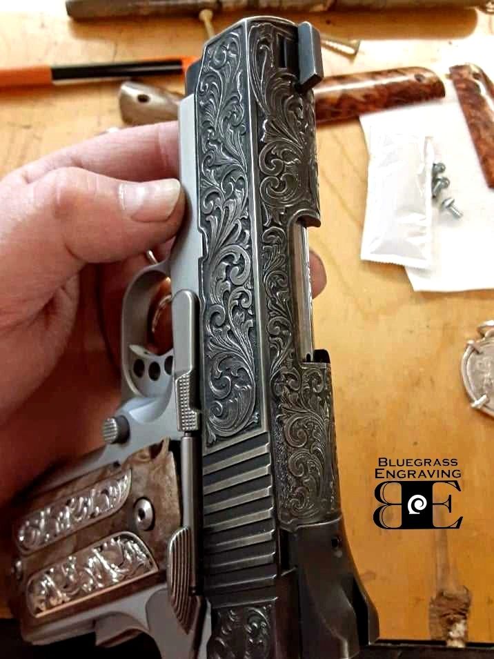 A 1911 Model hand engraved gun.