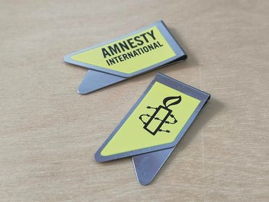 clip logo amnesty international, clip amnestia internacional, clip logo, sujetapapeles amarillo