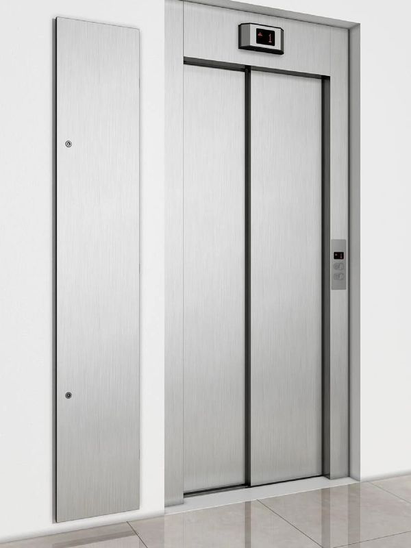 Modern closed elevator with stainless steel doors in a clean hallway.