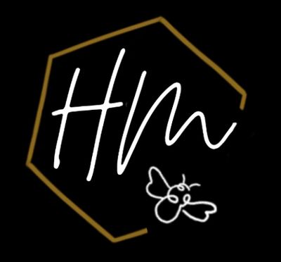 Stylized logo with 'Hm' and a small bee inside a golden hexagon on black background.