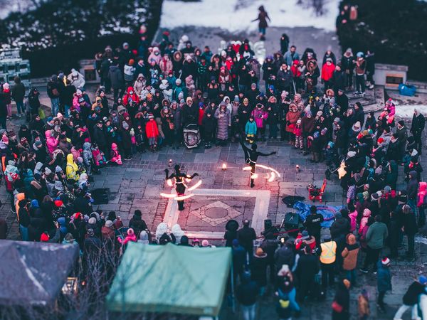 Drone view of Fire & Ice Winter Event in Mississauga featuring fire performance and a crowd of peopl