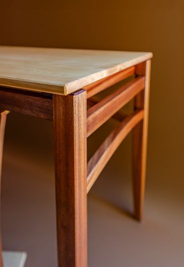 Close-up of a wooden table corner.