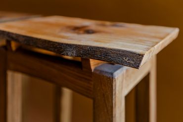 Close-up of rustic wooden table corner.