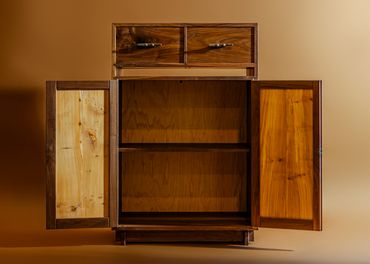Open wooden cabinet with two drawers and shelves.