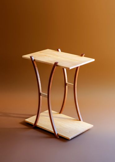 Upside-down wooden table with curved legs.