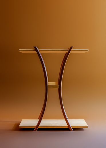 Elegant wooden shelf with curved supports.