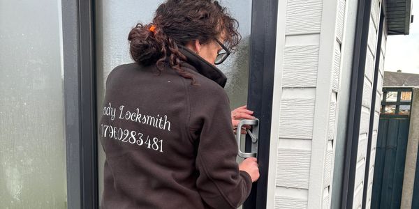 Curlylocks locksmith working on a door in Derbyshire.
