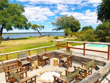 Outdoor fireplace on entertainment deck with Zambezi River view
