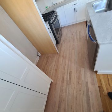 Kitchen hardwood replced, due to squeaking, revious installation issue.