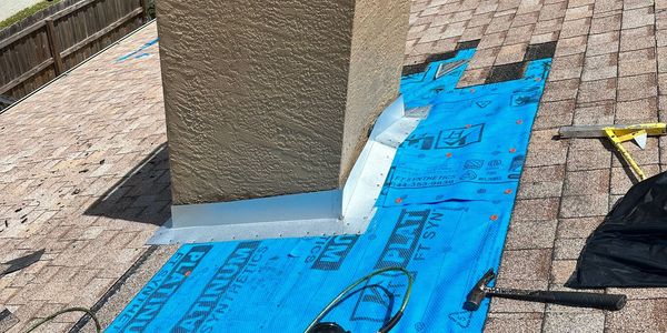 chimney repairs on residential home with exposed roofing underlayment