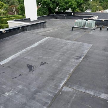EPDM rubber flat roof installation in Grosse Pointe, MI.