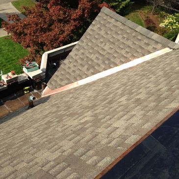 Dimensional asphalt shingle roof installation and custom copper roofing in Grosse Pointe Farms, MI.