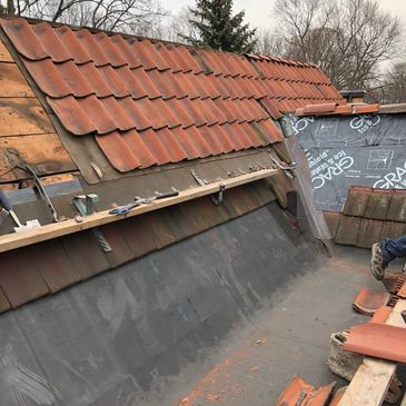 Tile roof restoration and repairs and EPDM rubber roofing in Grosse Pointe Park Michigan.