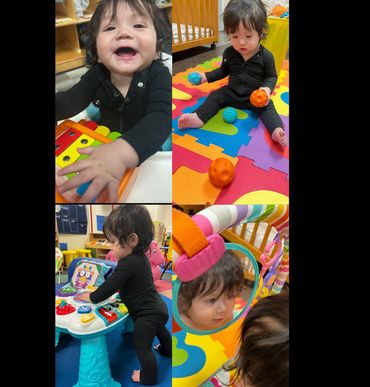 A happy toddler playing with toys and looking into a mirror.